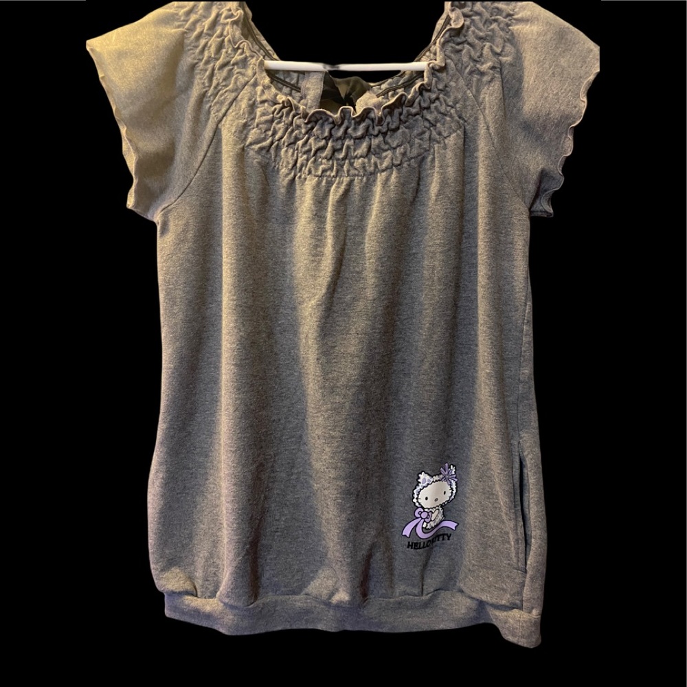 Sweater style shirt. Very cute and comfy!